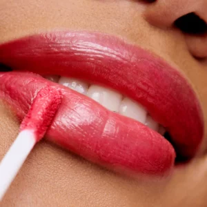 HydroPure™ Hyaluronic Acid Lip Gloss in Dark Berry Red — transparent tube with rich berry-red gloss and gold cap